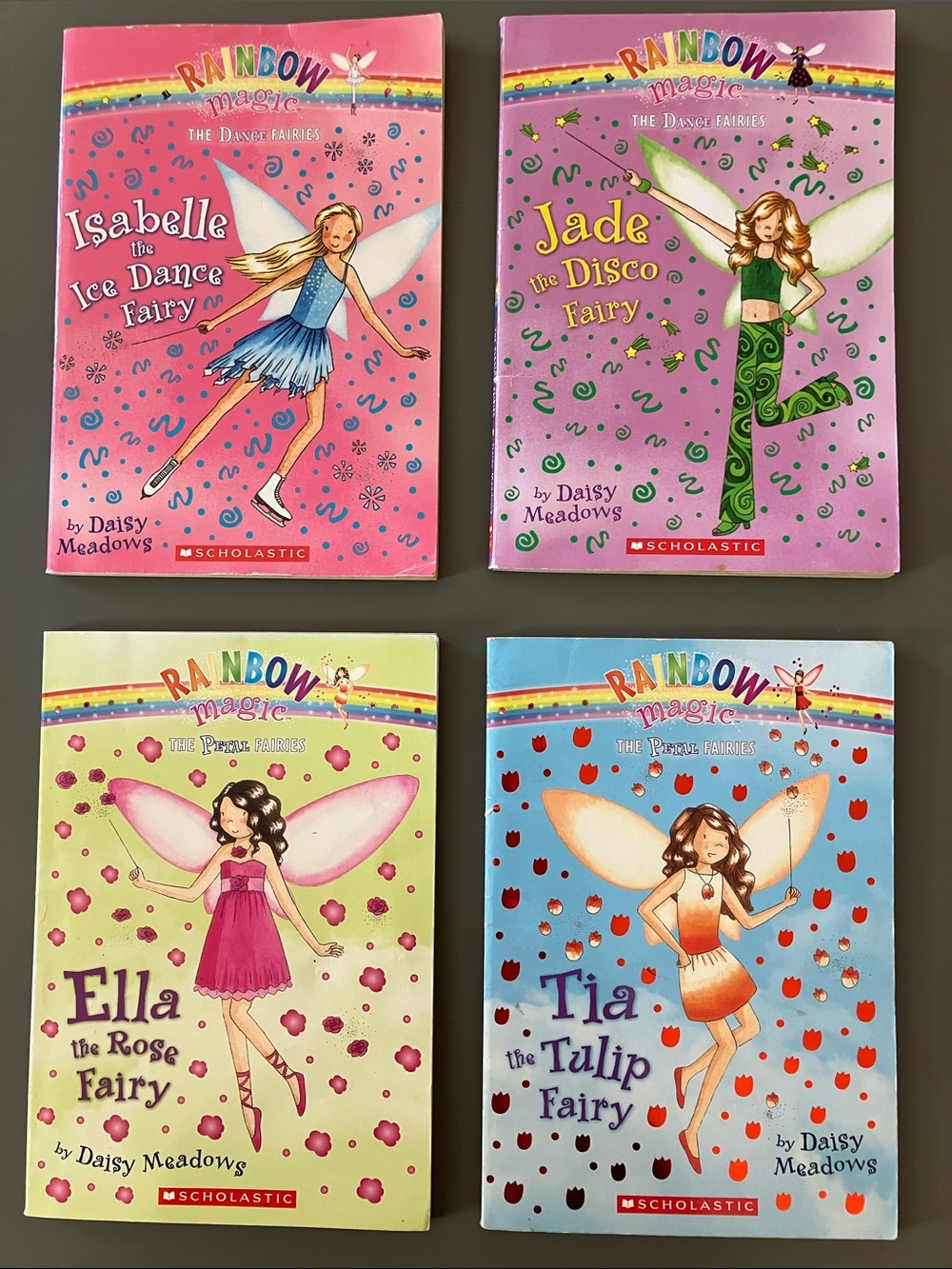🧚 ⛸️  🌹 💃 Scholastic Rainbow Magic Fairy Book Set of four. Dancing, flowers